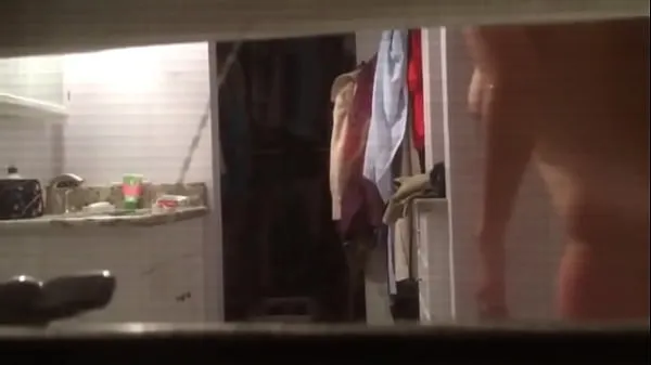 Show Spying on Milf towling off through window drive Clips