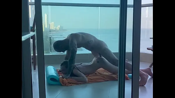 Hiển thị On a balcony in Cartagena, a young student gets her pretty little ass filled lái xe Clips