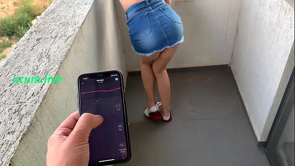 Show Controlling vibrator by step brother in public places drive Clips
